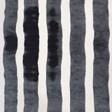 Grasscloth Wallpaper close up with bold watercolor stripes in black and white. 