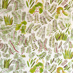Detail of wallpaper in a playful leaf print in shades of green and red on a cream field.