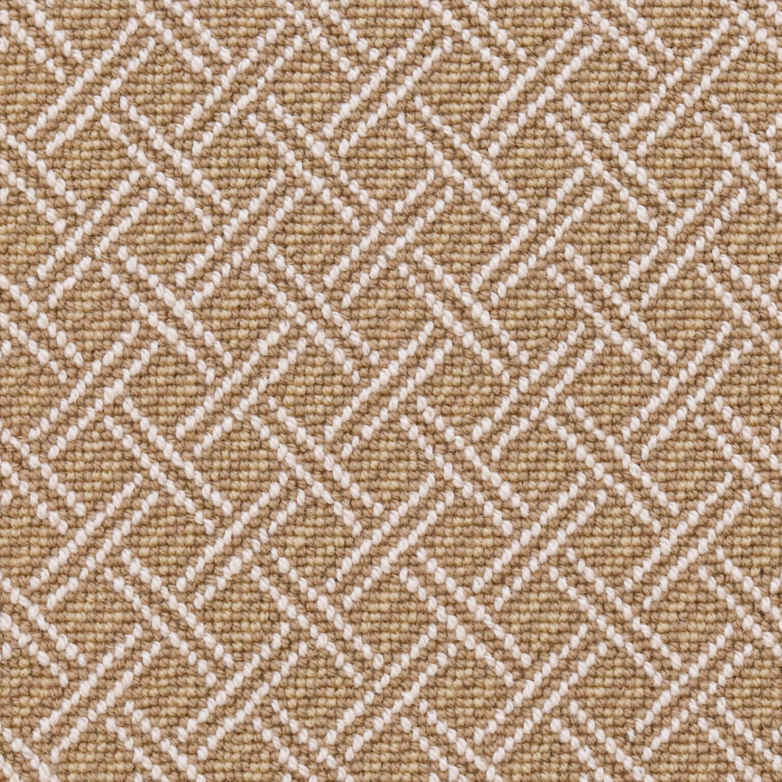 Broadloom carpet with ivory double line lattice on a tan field. 