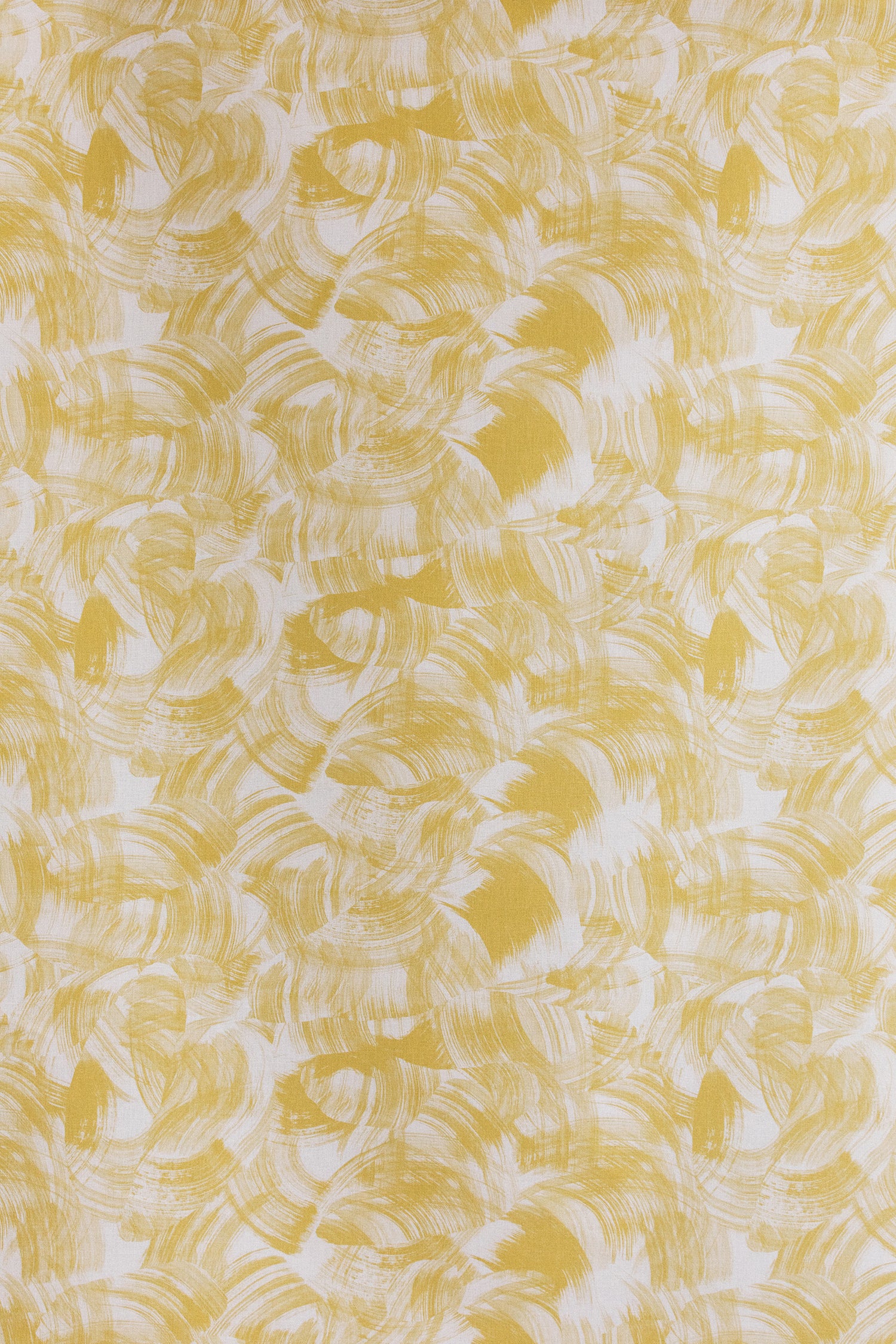 Detail of fabric in an absract paint swatch print in yellow on a white field.