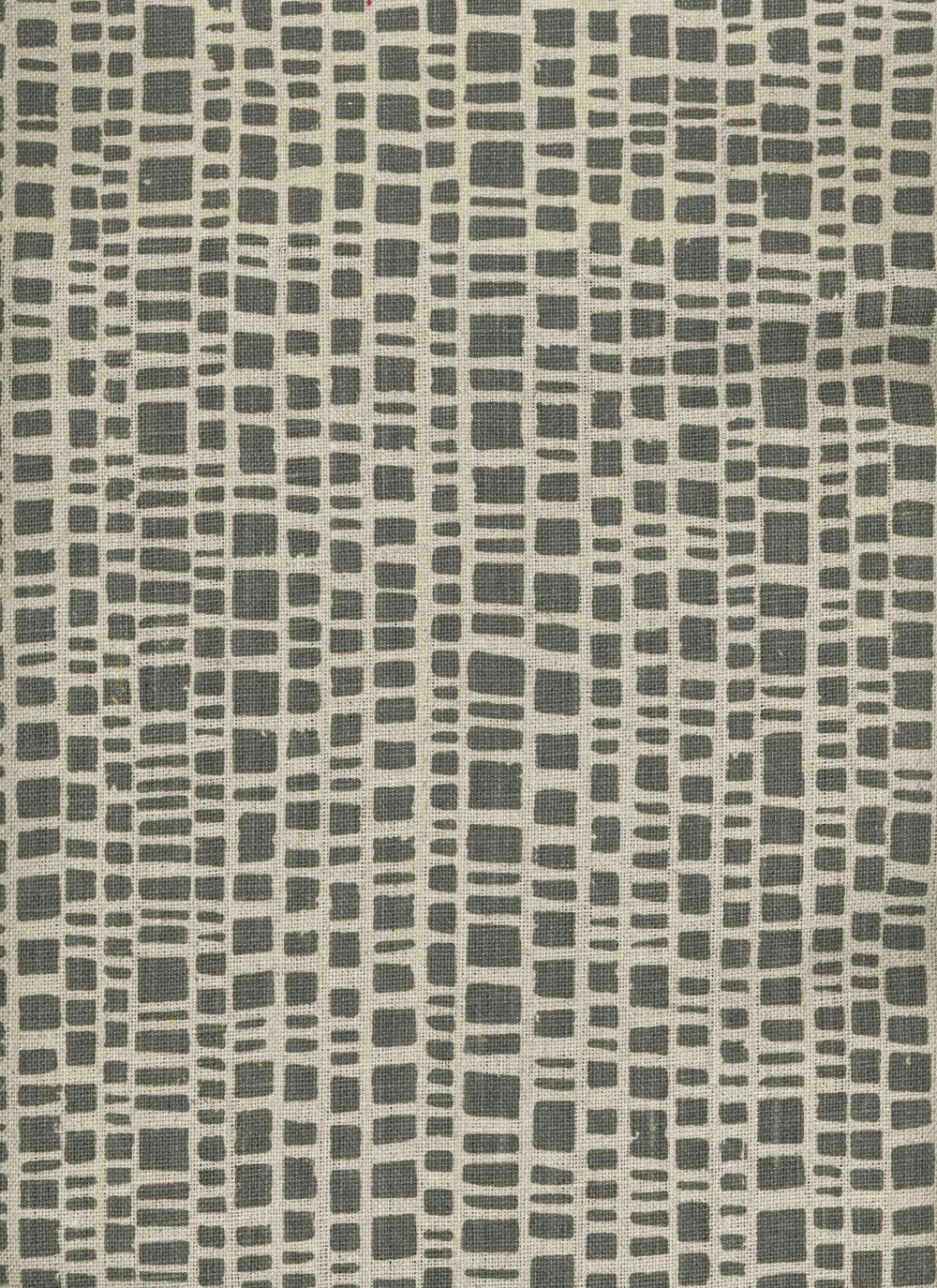 Detail of fabric in a textural grid print in gray on a cream field.