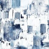 Detail of wallpaper in a watercolor textural print in shades of navy and blue on a white field.