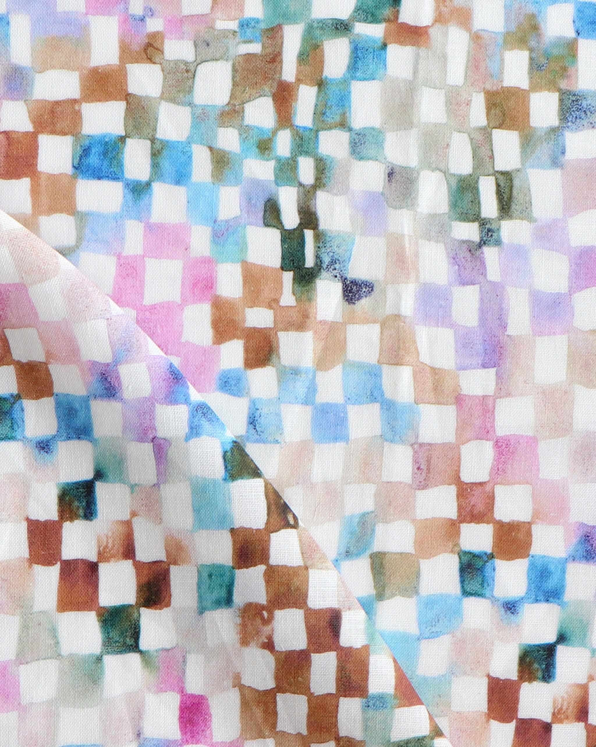 Detail of fabric in a painterly check pattern in shades of pink, brown and blue on a white field.