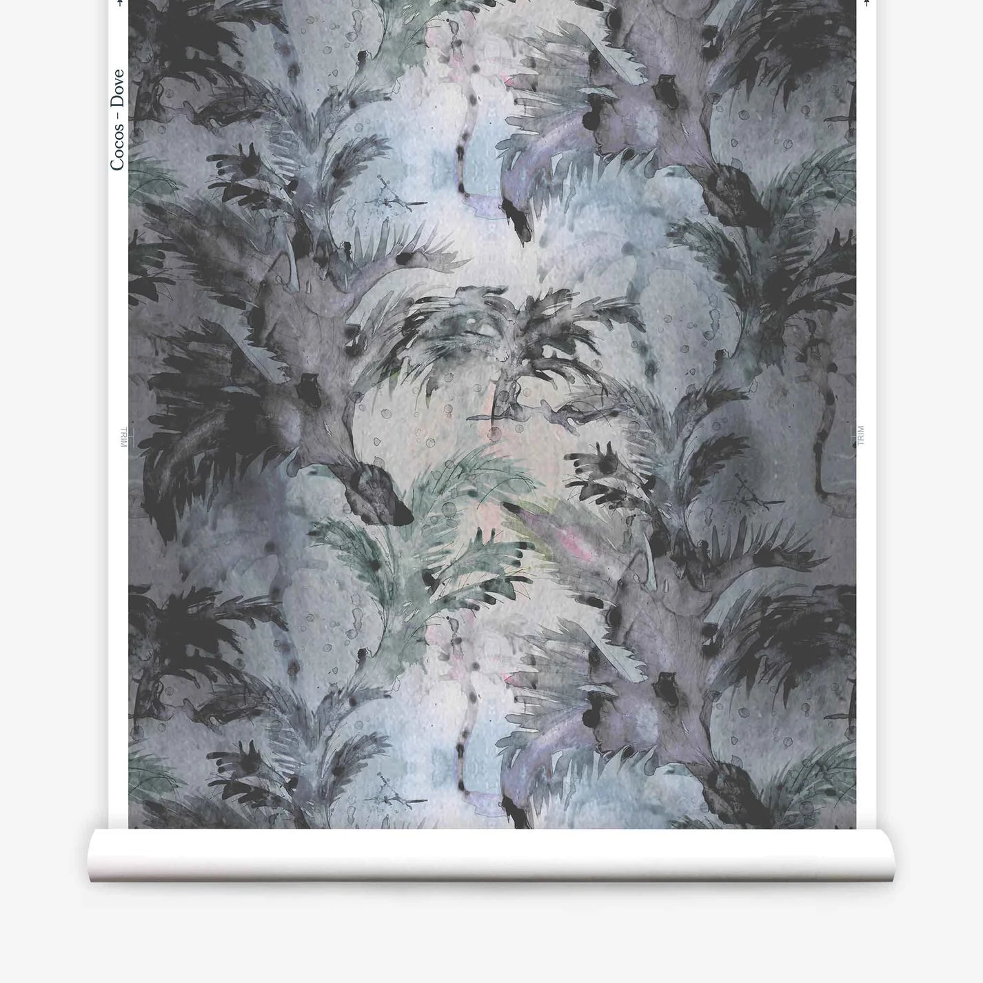 Partially unrolled wallpaper yardage in a painterly palm tree print in shades of gray and blue on a white field.
