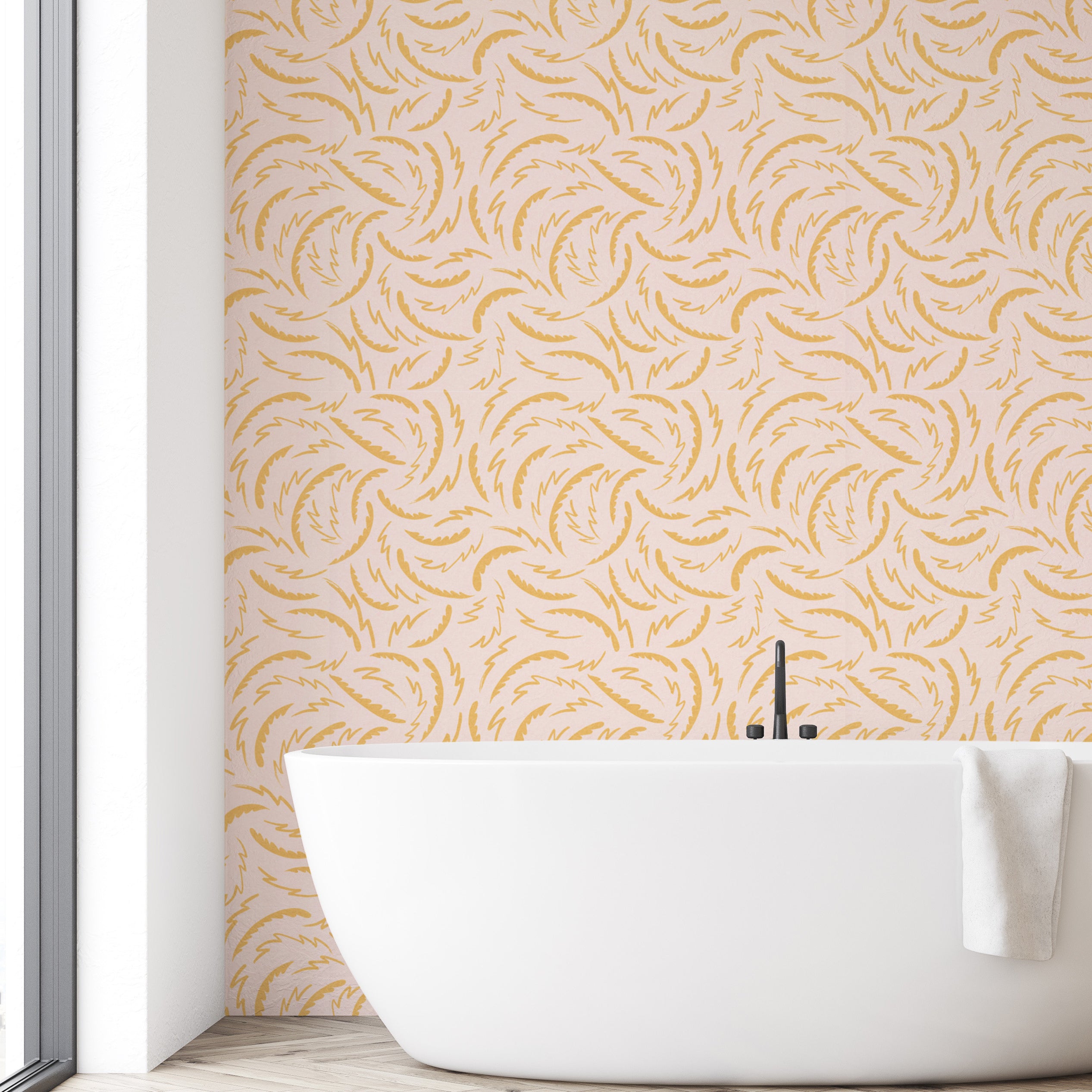Modern bathroom with a white freestanding bathtub against a wall with a gold leaf pattern.