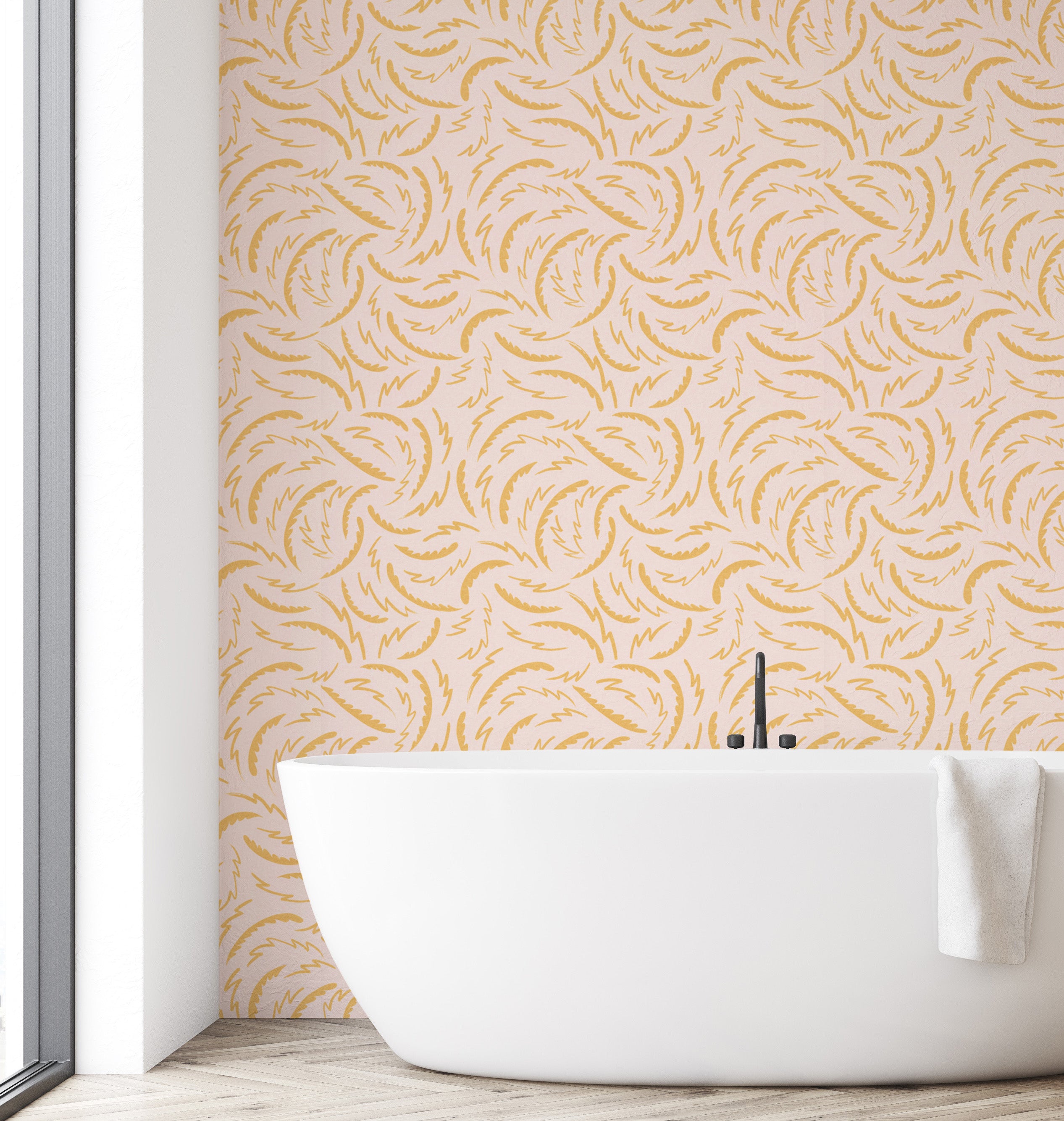 Modern bathroom with a white freestanding bathtub against a wall with a gold leaf pattern.