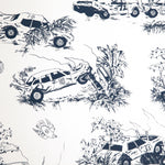 Detail of wallpaper in a playful illustrated car crash print in navy on a white field.