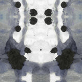 Detail of wallpaper in a watercolor ink blot print in shades of charcoal and gray on a white field.