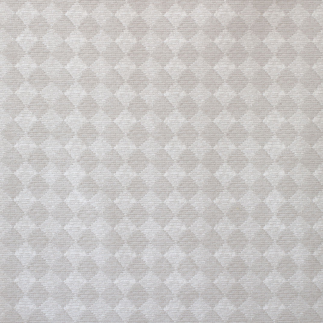 Detail of fabric in a textural diamond print in cream.