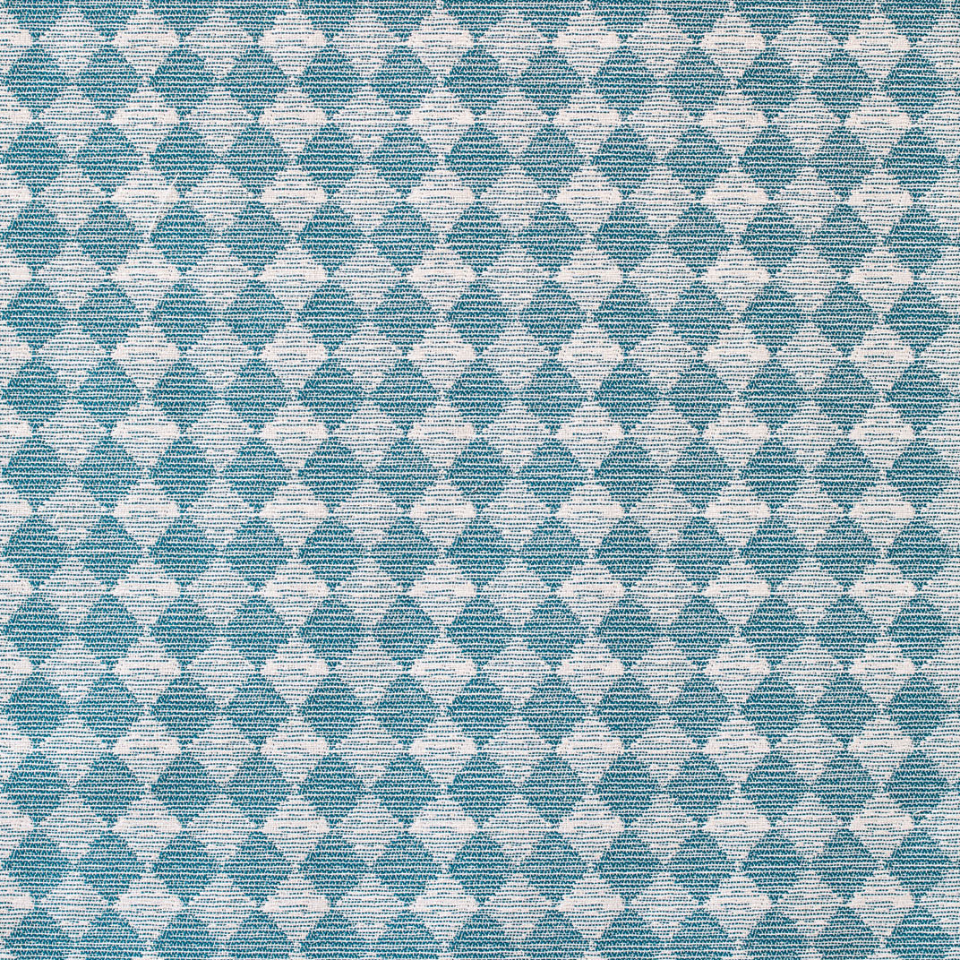 Detail of fabric in a textural diamond print in blue and cream.