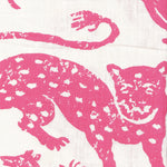 Detail of fabric in a playful animal print in pink on a cream field.
