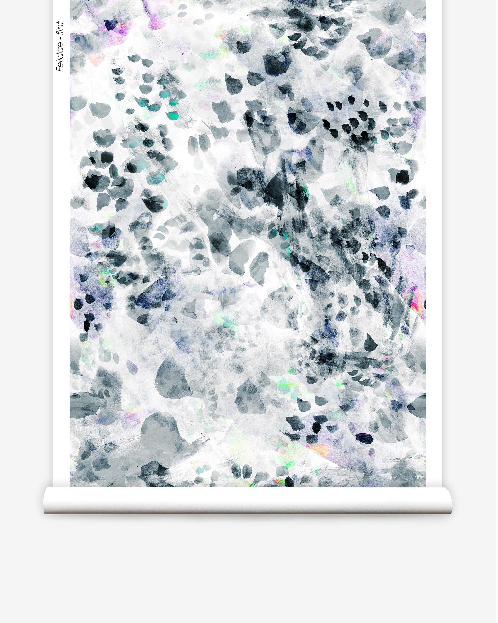 Partially unrolled wallpaper yardage in a watercolor paint blotch print in black, gray, blue, green and white.