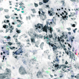 Detail of wallpaper in a watercolor paint blotch print in black, gray, blue and green on a white field.
