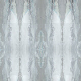 Detail of wallpaper in a watercolor textural print in shades of gray and blue-gray.