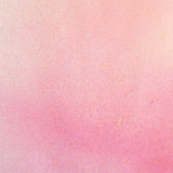 Detail of fabric in an abstract ombré paint splatter print in shades of pink, coral and white.