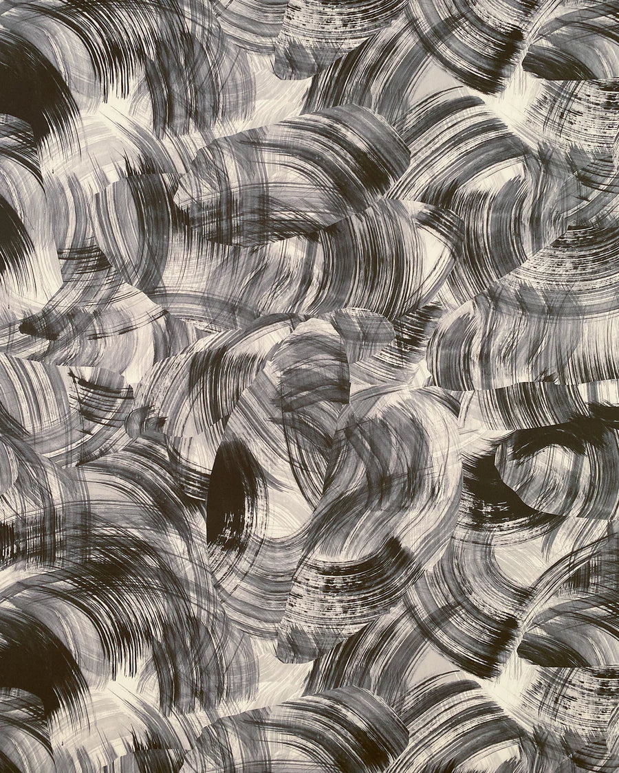 Detail of wallpaper in an abstract paint swatch print in black on a white field.