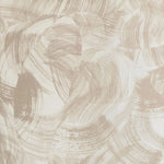 Detail of wallpaper in an abstract paint swatch print in tan on a cream field.