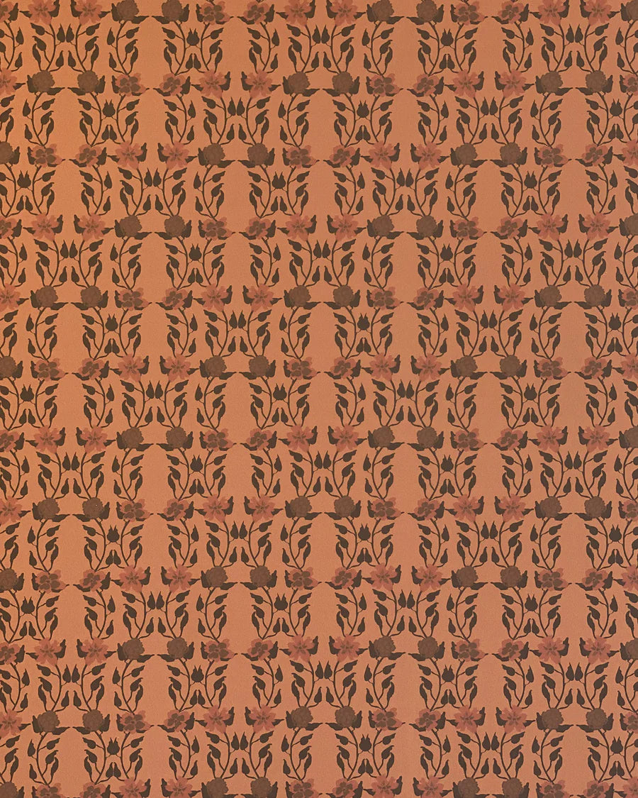 Detail of wallpaper in a linear floral print in red and black on an orange field.