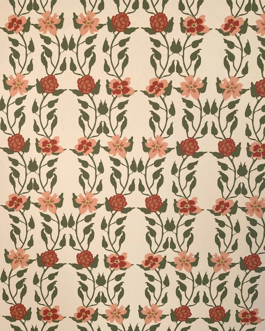 Detail of wallpaper in a linear floral print in red, orange and green on a cream field.