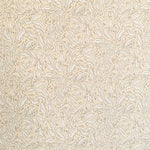 Detail of wallpaper in a painterly leaf print in tan and white on a cream field.