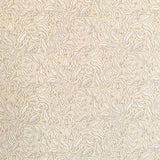 Detail of wallpaper in a painterly leaf print in tan and white on a cream field.