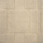 Handknotted custom rug in ivory with dimensional square pattern.