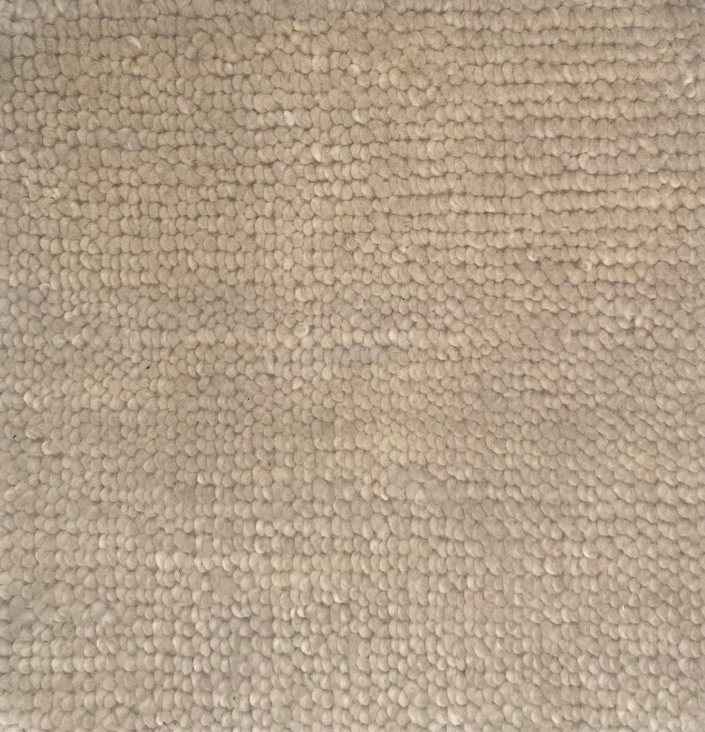 Handknotted rug in a textural loop in ivory. 
