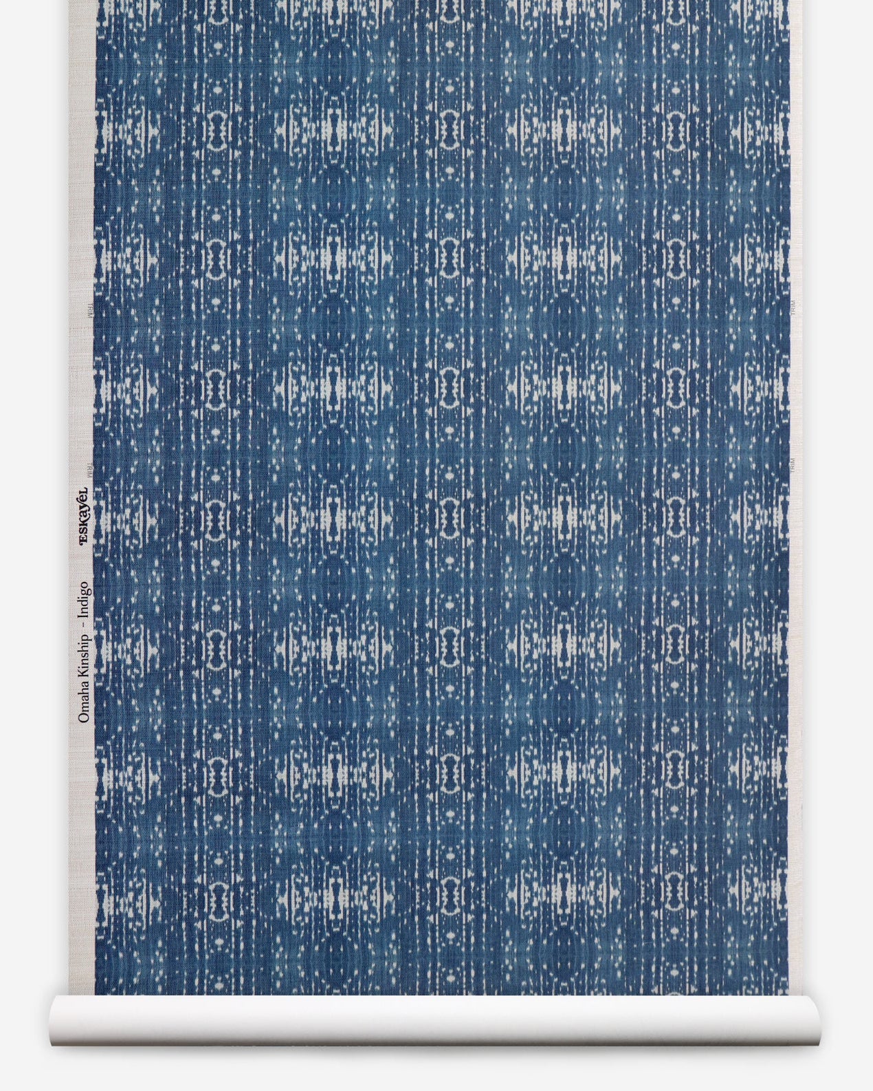 Roll of printed grasscloth with ikat stripe design in blue and cream 