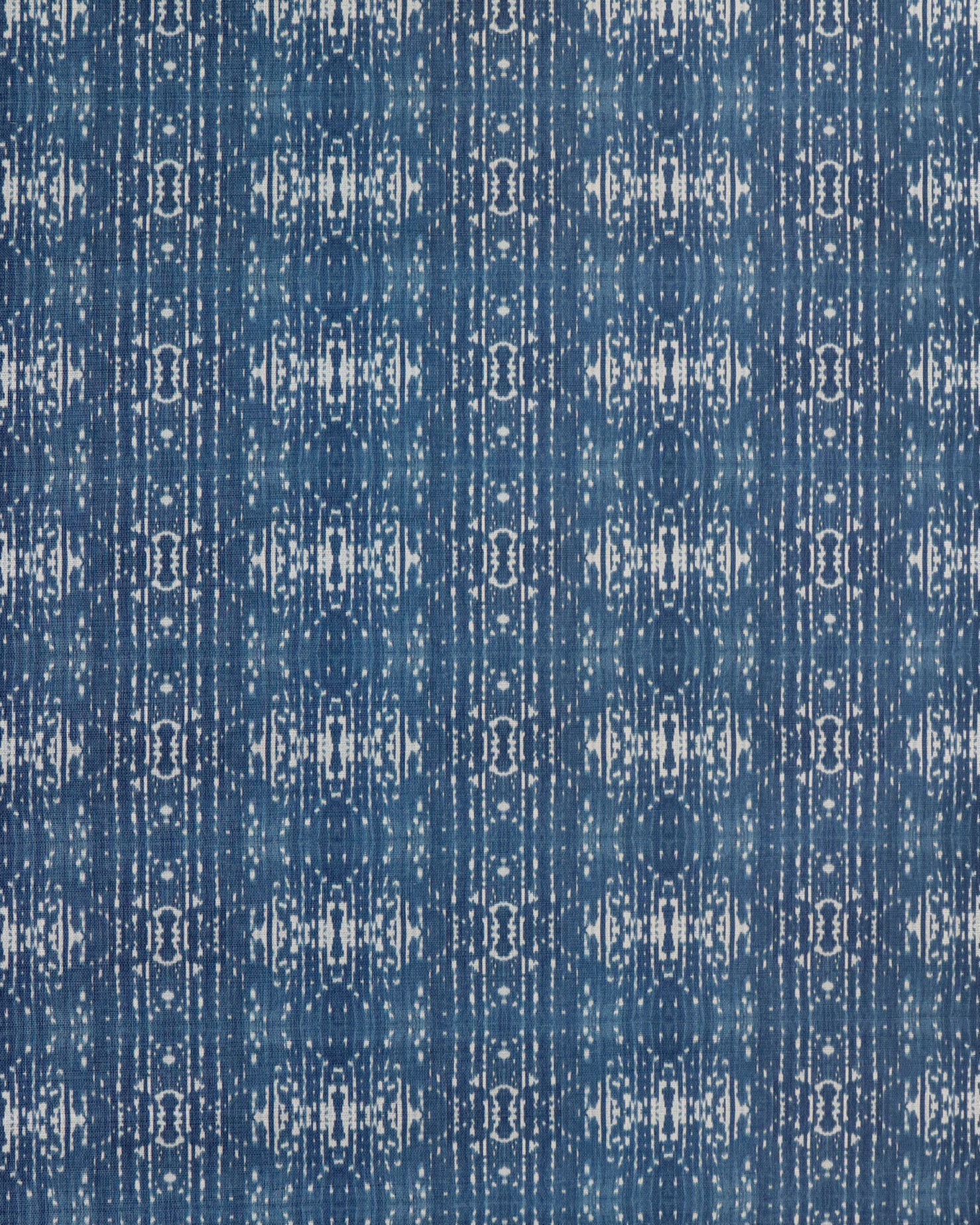 Printed grasscloth with ikat stripe design in blue and cream 