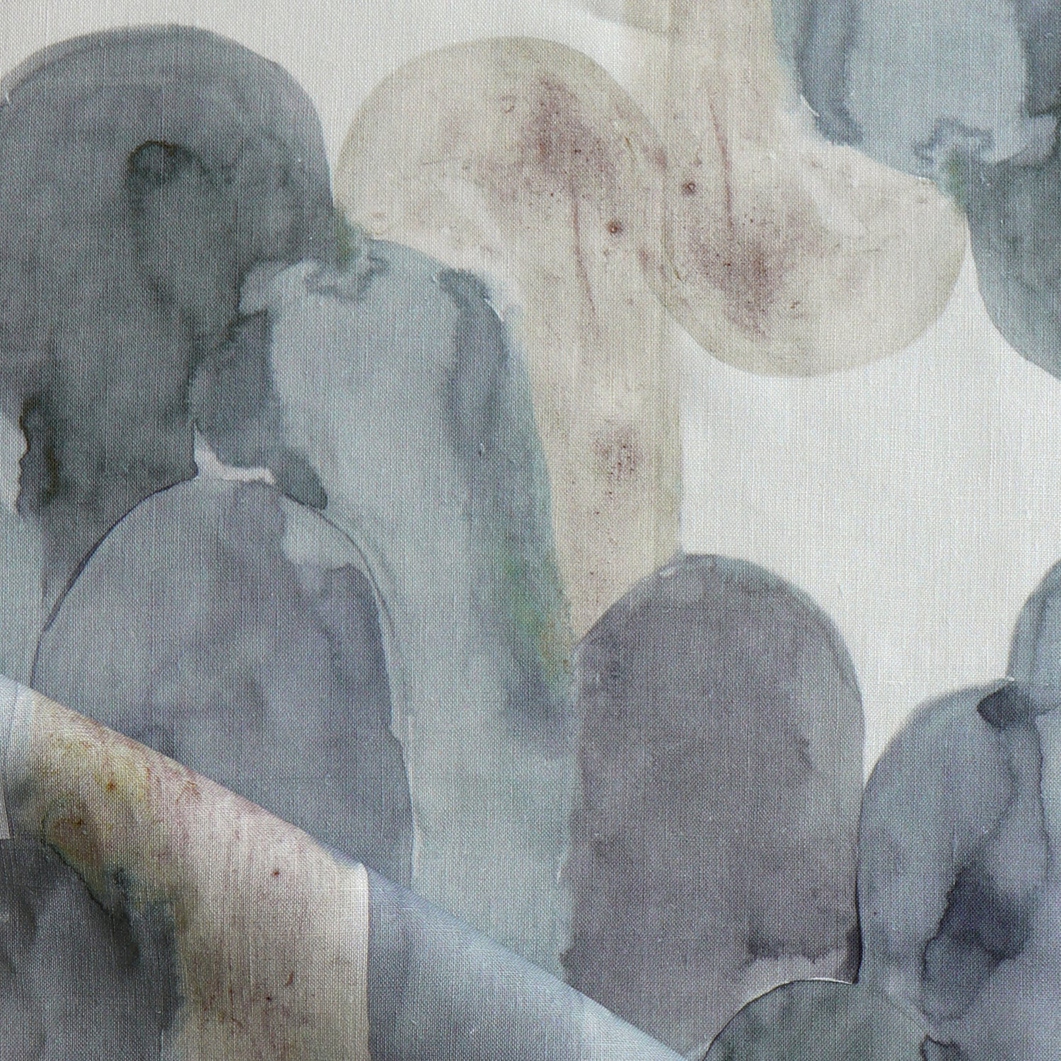 Detail of draped fabric in watercolor elongated pill pattern in moody blues and taupe on a white field.
