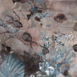 Draped fabric in an underwater sealife scene in shades of mauve, grey and turquoise. 