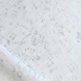 Detail of draped fabric in a painterly bandana print in light gray on a white field.