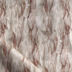 Draped fabric in a layered squiggle watercolor pattern in shades of brown