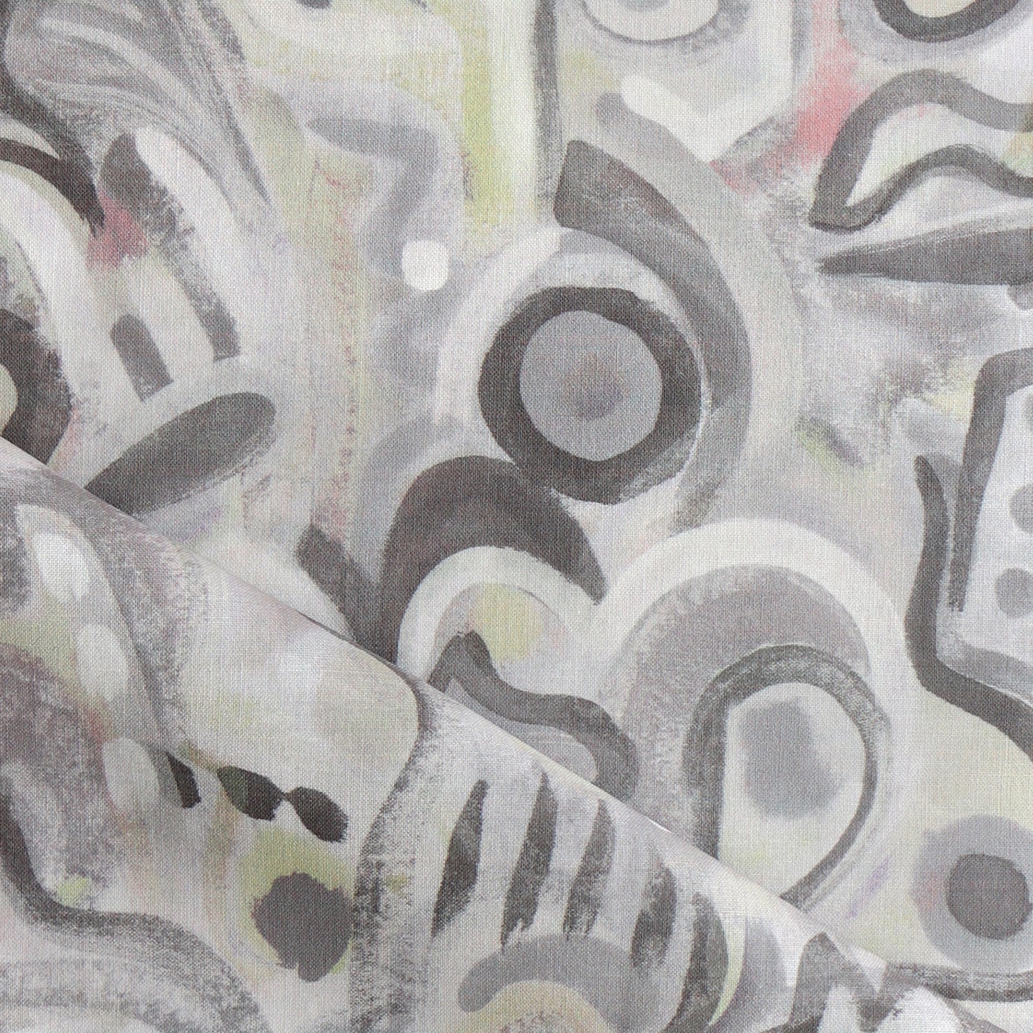 Draped fabric in abstract brushstroke design in shades of grey, tan and blush accents. 