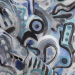 Draped fabric in abstract brushstroke design in shades of blue, aqua and black accents. 