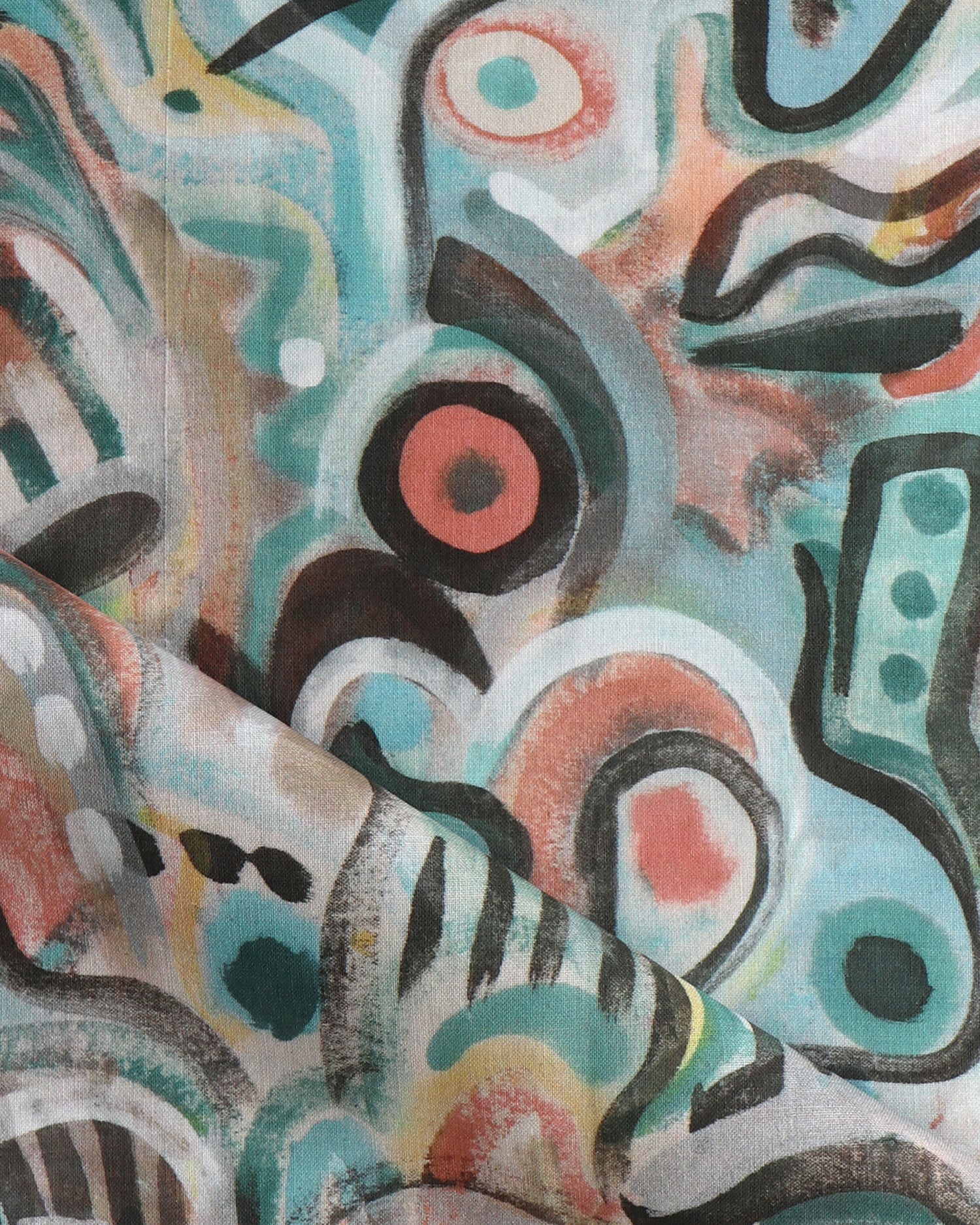 Draped fabric in abstract brushstroke design in shades of teal, rust brown and black accents. 