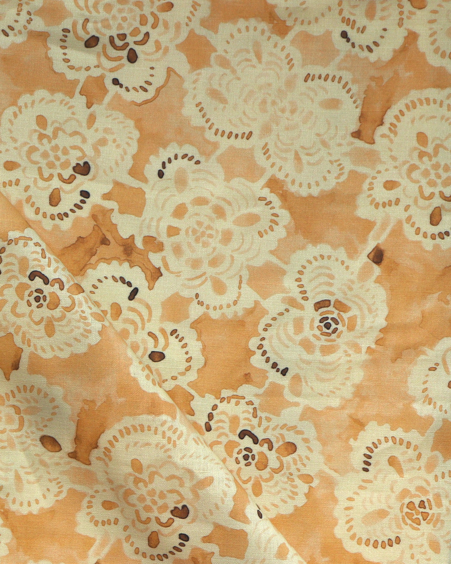 Patterned fabric with lace-like design on an yellow background