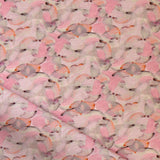 Draped fabric in an undulating abstract watercolor motif in pink, orange and grey. 