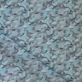 Draped fabric in an undulating abstract watercolor motif in shades of steel blue and charcoal. 