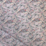 Draped fabric in an undulating abstract watercolor motif in light purple, blush, rust and charcoal.