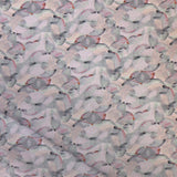 Draped fabric in an undulating abstract watercolor motif in light purple, blush, rust and charcoal.