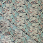 Draped fabric in an undulating abstract watercolor motif in sage green, grey and brown. 