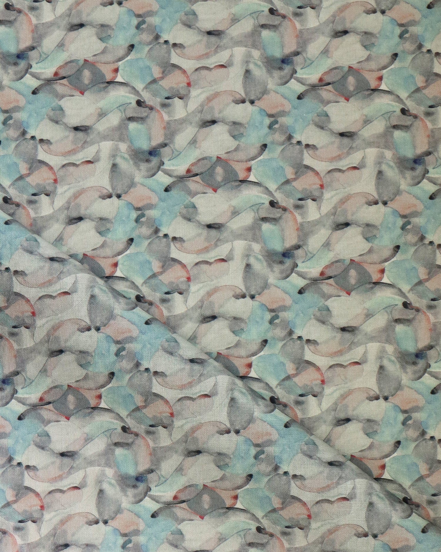 Draped fabric in an undulating abstract watercolor motif in sage green, grey and brown. 