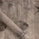 Draped fabric in an watercolor oceanic fish pattern in warm taupe.