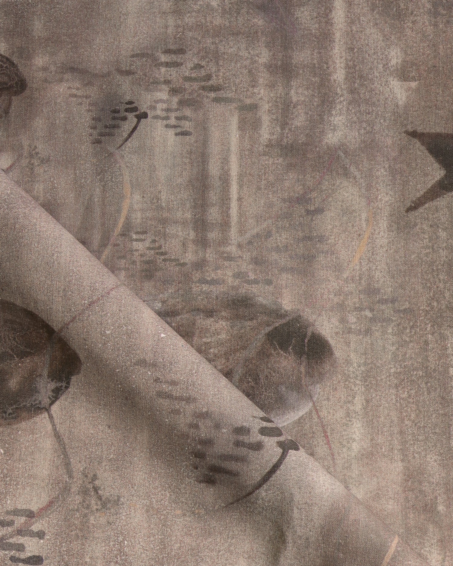 Draped fabric in an watercolor oceanic fish pattern in warm taupe.