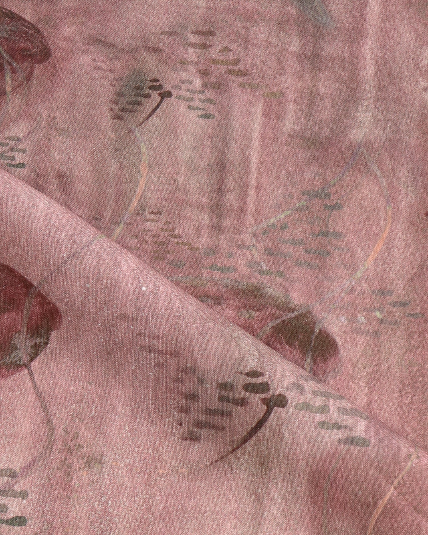 Draped fabric in an watercolor oceanic fish pattern in warm clay red. 