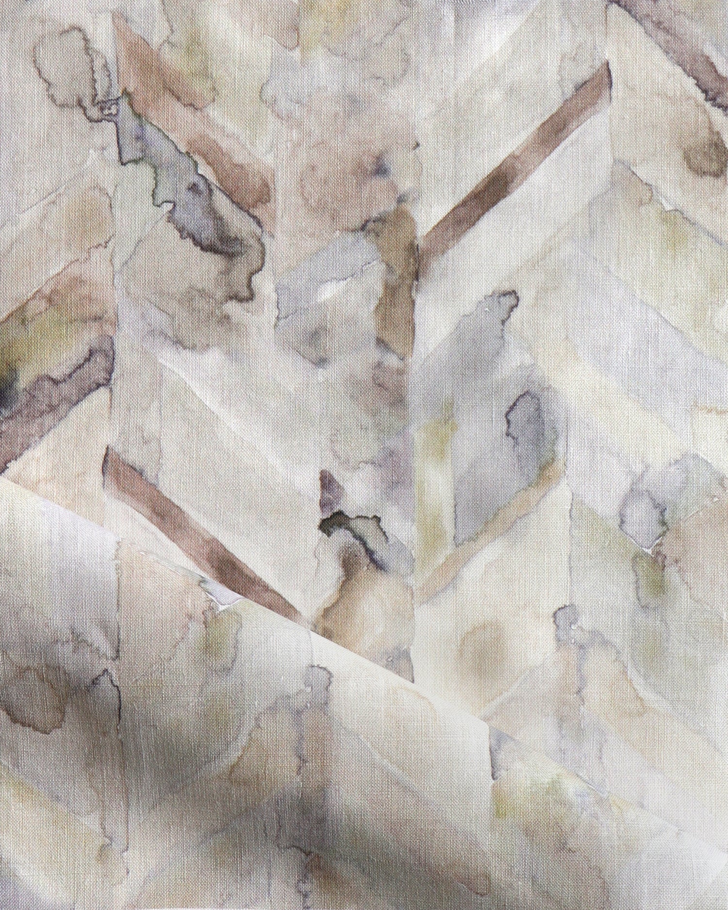 Detail of draped fabric in a painterly herringbone print in shades of gray, tan and cream.