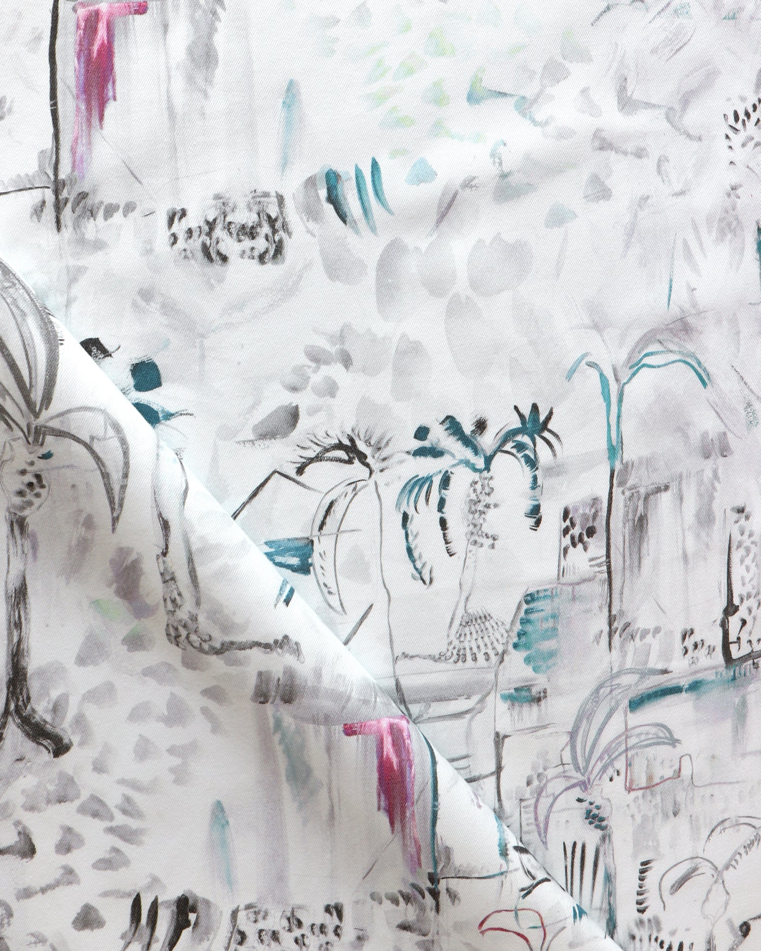 Detail of draped fabric in a painterly tree print in shades of gray, white, turquoise and pink.