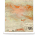 Wallpaper roll of an ethereal watercolor mural in shades rust red, warm orange, tan, and taupe.