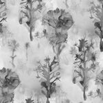 Detail of wallpaper in a watercolor tree print in shades of gray and black on a white field.